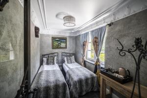 Postel nebo postele na pokoji v ubytování SAFARI HOUSE - Wisła