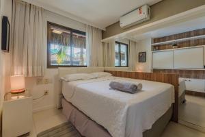 Ένα ή περισσότερα κρεβάτια σε δωμάτιο στο Parque das Ilhas #102 - Excelência por Carpediem +45 φωτογραφίες