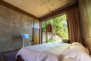 A bed or beds in a room at One Brick Great Wall Heritage B&B Még 37 kép