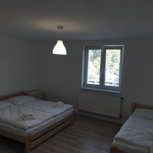 Ένα ή περισσότερα κρεβάτια σε δωμάτιο στο Apartmán Stará Myjava
