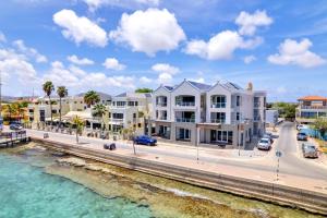 an aerial view of a building next to the water at Las Dunas with Stunning Sea View and Shared Pool in Kralendijk