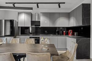 a kitchen with a table with wine glasses on it at Villa Nene in Benažići