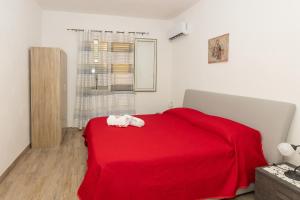 Posteľ alebo postele v izbe v ubytovaní Casa Vacanze Panorama sulle Egadi + 37 fotografií