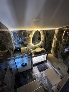 a bathroom with a stove and a sink and a mirror at Asteris luxury house in Polygryos +27 photos