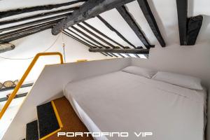Postel nebo postele na pokoji v ubytování Limoni by PortofinoVip