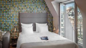 Posteľ alebo postele v izbe v ubytovaní VN17 Rooftop Suites by Adrez