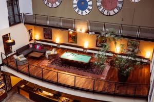 an overhead view of a large living room with a pool table at Gastwerk Hotel Hamburg in Hamburg