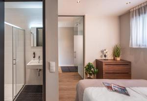 Kúpeľňa v ubytovaní VN17 Rooftop Suites by Adrez