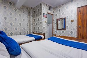 Rúm í herbergi á Chengfu Hotel And Restaurant