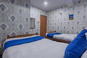 Rúm í herbergi á Chengfu Hotel And Restaurant