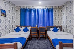 Rúm í herbergi á Chengfu Hotel And Restaurant