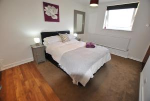 a bedroom with a large bed with a window at The Studios, Dedworth Road, by Accommodation Windsor in Windsor