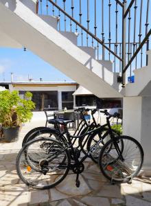 a bike is parked next to a staircase at Apartamentos in El Poblenou del Delta
