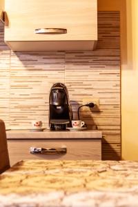 Kuchyň nebo kuchyňský kout v ubytování B&B Piazza Noua 1831
