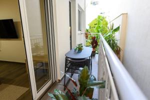 TV a/nebo společenská místnost v ubytování Kastella Bohemian Pied a Terre