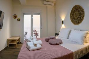 Postel nebo postele na pokoji v ubytování Kastella Bohemian Pied a Terre
