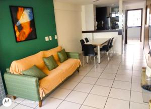 a living room with a couch and a table at Apartamento Em Fortaleza De Frente Para O Mar in Fortaleza