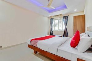 Postel nebo postele na pokoji v ubytování Collection O Champion Paradise