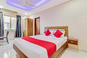 Postel nebo postele na pokoji v ubytování Collection O Champion Paradise + 21 fotografií