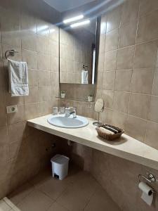 a bathroom with a sink and a mirror at Zen Apartment Tenerife in San Miguel de Abona