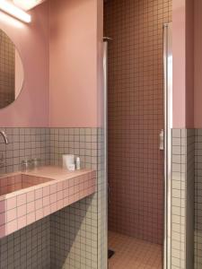 a bathroom with a sink and a shower at New Hotel Op&eacute;ra in Paris