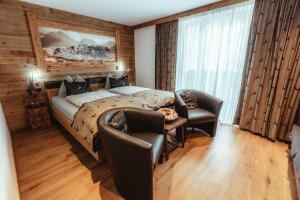 Postel nebo postele na pokoji v ubytování Hotel Gasthof Walcher