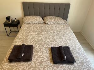 Ένα ή περισσότερα κρεβάτια σε δωμάτιο στο L'Olympe de Deuil 10 min de Paris 1 min de la gare