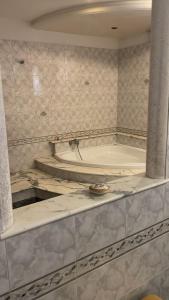 a bathroom with a tub and a sink at La casa di Sonia in Fanusa
