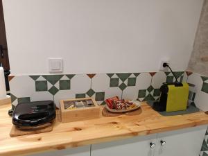 a kitchen counter with a toaster on top of it at Casa Lehovo in Lechovo