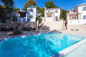 a large swimming pool in front of a house at Luxury Villa at Pelion- Ruby in Zagora