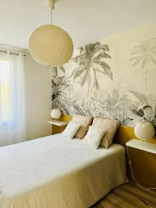 a bedroom with a bed with two pillows at Le Bon Compromis in Poitiers