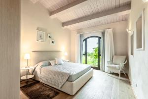 Postel nebo postele na pokoji v ubytování Cignella Resort + 37 fotografií