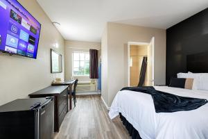 Postel nebo postele na pokoji v ubytování Hotel Dilley Grand + 22 fotografií