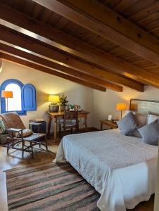 Postel nebo postele na pokoji v ubytování Hostal de la Plaça - Hotel Boutique