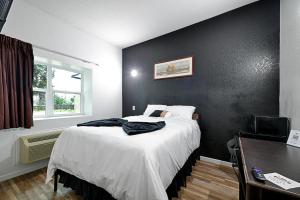 Postel nebo postele na pokoji v ubytování Hotel Dilley Grand