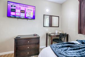 Postel nebo postele na pokoji v ubytování Hotel Dilley Grand