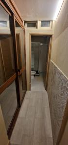 a hallway of a bathroom with a toilet in a room at City Center Mindelo 37 in Mindelo