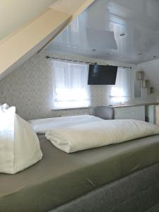 Postel nebo postele na pokoji v ubytování Klein Haus 12A