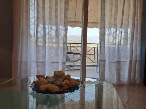 a plate of food on top of a glass table at Victoria's house in Kalamata +20 photos