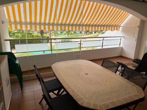 a table and chairs in a room with a large window at Torresnostra see experience in Torreblanca