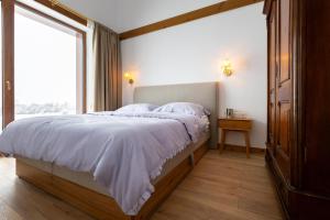 Postel nebo postele na pokoji v ubytování Villa Sofayla near the Pirin Golf Resort
