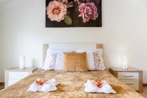 En eller flere senge i et værelse på Casa da Avó