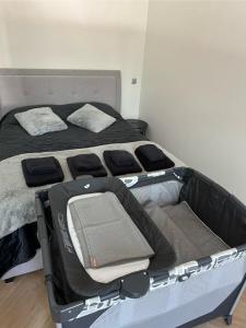 a bed with an open suitcase in a room at Stylish apartment in the heart of Tallinn, free parking in Tallinn