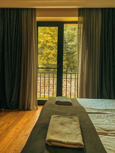 Rúm í herbergi á Hotel Gold Kazbegi