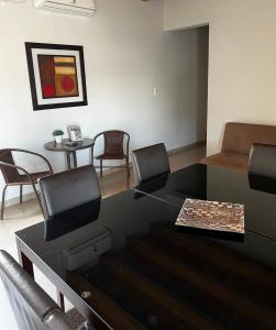 a living room with a table and chairs at Departamento en Mendoza in Guaymallen