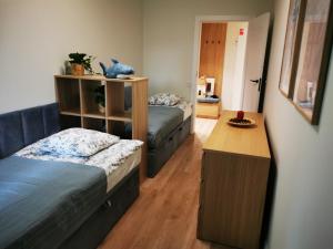 Postel nebo postele na pokoji v ubytování Zielony Zakątek Merwede - 50m od morza