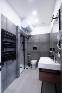 a bathroom with a sink and a toilet at Napoli Factory Guest House in Naples