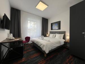Postel nebo postele na pokoji v ubytování Apartamenty Makadamia + 19 fotografií