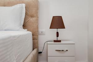 Ein Bett oder Betten in einem Zimmer der Unterkunft Riviera Hotel-City Center