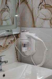 Ein Badezimmer in der Unterkunft Riviera Hotel-City Center